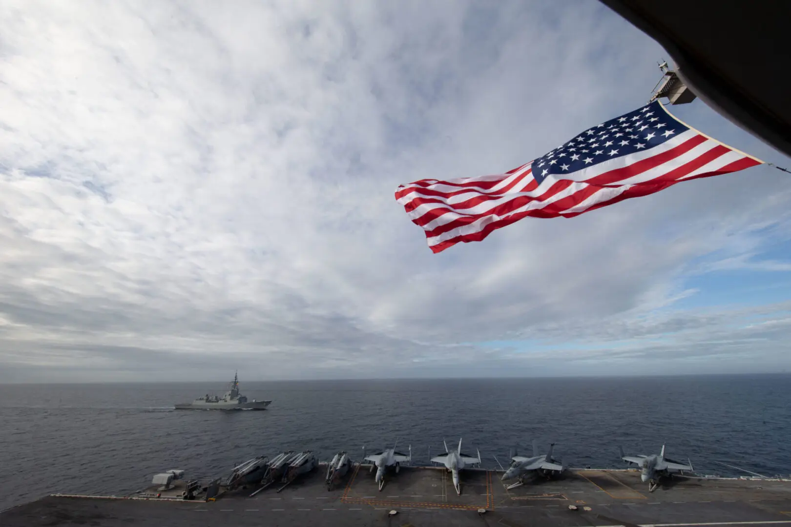 ATLANTIC OCEAN (Oct. 25, 2022) The first-in-class aircraft carrier USS Gerald R. Ford (CVN 78) flies the holiday American Flag while steaming in formation with Spanish Armada frigate Álvaro de Bazán (F 101), Oct. 25, 2022. The Gerald R. Ford Carrier Strike Group (GRFCSG) is deployed in the Atlantic Ocean, conducting training and operations alongside NATO Allies and partners to enhance integration for future operations and demonstrate the U.S. Navy’s commitment to a peaceful, stable and conflict-free Atlantic region. (U.S. Navy photo by Mass Communication Specialist 2nd Class Zack Guth)