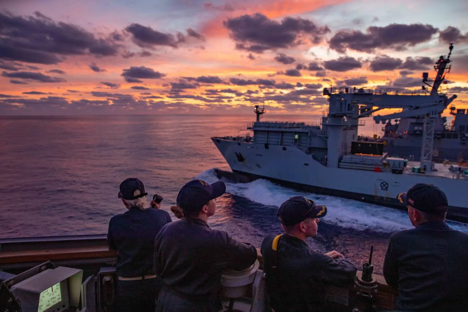 ATLANTIC OCEAN (Oct. 16, 2022) Sailors assigned to the Arleigh Burke-class guided-missile destroyer USS Ramage (DDG 61) look on during a replenishment-at-sea with the Royal Canadian supply ship MV Asterix as part of the Gerald R. Ford Carrier Strike Group, Oct. 17, 2022. The first-in-class aircraft carrier USS Gerald R. Ford (CVN 78) is on its inaugural deployment conducting training and operations alongside NATO Allies and partners to enhance integration for future operations and demonstrate the U.S. NavyÕs commitment to a peaceful, stable and conflict free Atlantic region. (U.S. Navy photo by Mass Communication Specialist 2nd Class Sawyer Connally)
